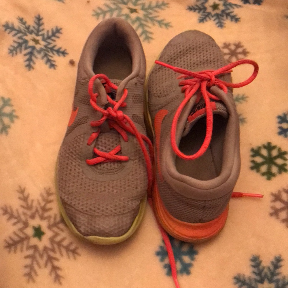 Green, pink, and gray colored Nike sneakers.